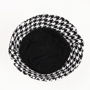 Classic houndstooth bucket hat for women in black and white knit with cozy lining