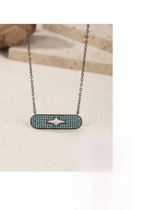 Macro detail of S925 silver necklace with blue stone pavé and star cutout pendant