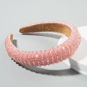 Padded pink crystal headband with luxury beaded embellishments and suede lining