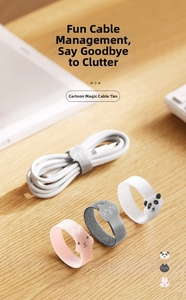 Close-up of animal-shaped cable ties featuring pink rabbit and panda motifs on desk