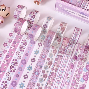 Detail of floral washi tape set in pink and purple colors with romantic gold stamping