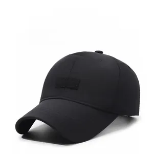 Close-up of black baseball cap featuring a lion crest patch and 10.18 CAPS embroidery