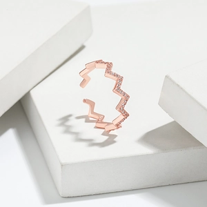 Detailed macro view of S925 sterling silver stamp on rose gold zircon wave ring
