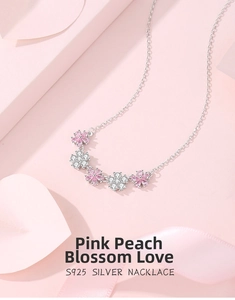 Detail of S925 silver necklace with pink peach blossoms and inlaid zircon stones