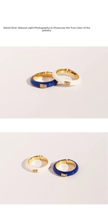 Detail shot of navy blue and white enamel rings with rectangular zircon stones