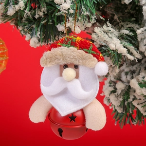 Close-up of Santa Claus plush bell ornament with star cutouts on a snowy Christmas tree
