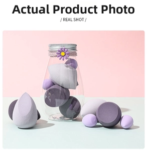 Detail of purple makeup sponges in various shapes and sizes with a clear storage jar