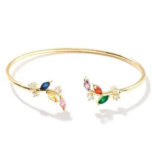 Detail of gold willow branch cuff with multi-color zircon stones and size dimensions