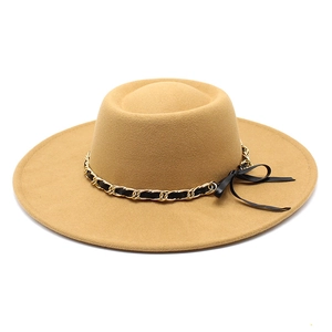 Close-up of khaki wide-brim felt hat featuring a gold chain and black bow detail