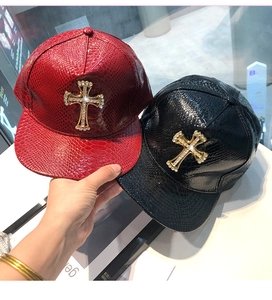 Close-up of snake skin texture and rhinestone cross on laser PU leather baseball caps