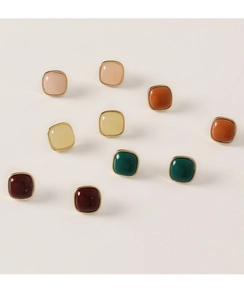 Close-up of colorful square stud earrings with gold plating in five vibrant resin finishes