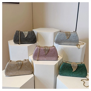 Detail view of glitter evening bags in five colors with metal leaf clasp and gold chains