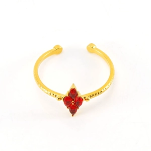 Detailed macro view of gold adjustable ring with four red marquise-cut zircon stones