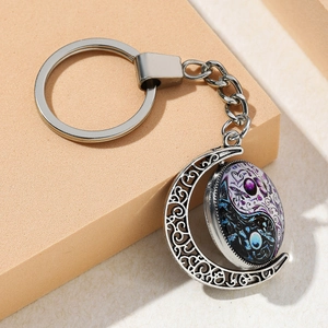 Silver yin yang butterfly moon pendant keychain with purple and blue swirl texture