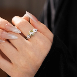 Macro shot of silver flower ring featuring yellow oval zircon and sparkling white crystals