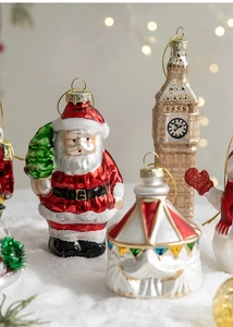 Detail of Christmas glass ornaments including Santa and Big Ben with festive glitter