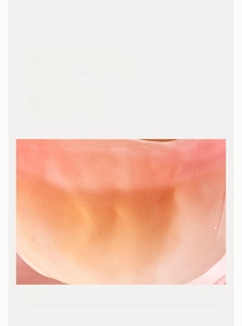 Close-up of pink crystal glaze teacup showing smooth edges and translucent texture