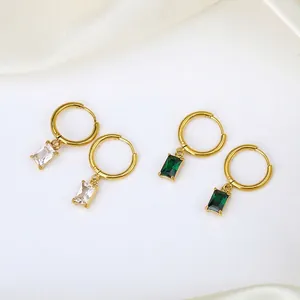 Elegant gold hoop earrings with emerald and clear zircon rectangle pendants on white silk
