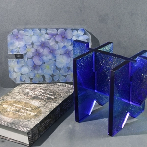 Detail of DIY epoxy resin stool mold with embedded dried hydrangea flowers and glitter effect