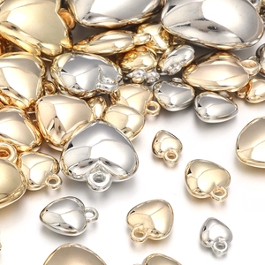 Polished gold and silver heart pendants in various sizes for DIY jewelry making