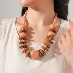 Close-up of vintage wooden and coconut shell beaded necklace on a model
