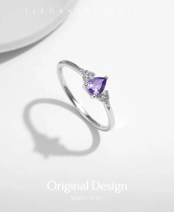Detailed view of s925 silver ring featuring a pear-shaped purple crystal with diamonds