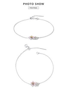 Detail of 925 sterling silver cherry blossom bracelet with pink and white enamel petals