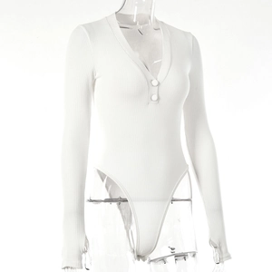 Close-up of white ribbed bodysuit featuring deep V-neckline and button front details