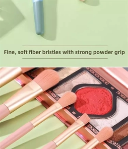 Macro detail of soft synthetic fiber bristles and pink handles for eye makeup brushes