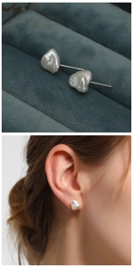 Baroque pearl earrings with S925 silver studs shown on ear and in jewelry box