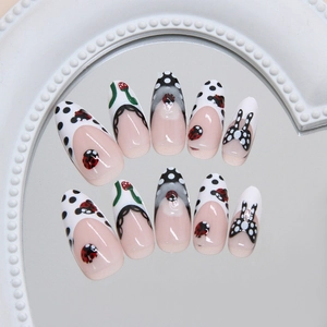 Handmade ladybug and strawberry almond press-on nails with 3D dots and French tips
