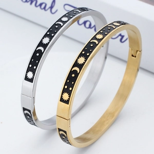 Minimalist celestial sun moon star stainless steel bangle with black enamel finish