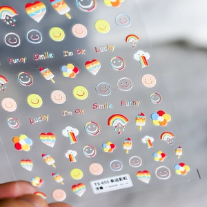 Detail of 5D embossed nail art stickers with lucky rainbow, smile, and heart patterns