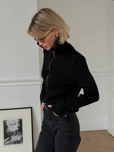 Slim-fit black knit sweater for women with half-zip design and minimalist long sleeves
