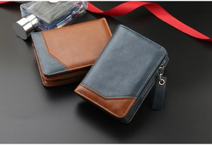 Short vintage leather wallets for men in navy and brown on a dark professional background