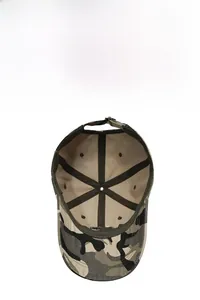 Detailed interior of camo baseball cap showing breathable holes and metal buckle