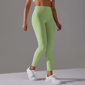 Detail of high-waist yoga leggings in teal green with seamless belly control and lift