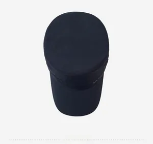 Detail of navy flat top cap showing breathable mesh holes and quick-dry fabric texture