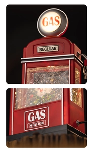 Detailed macro view of vintage red gas station snow globe with internal LED glow and glitter