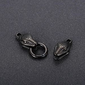 Pair of black stainless steel double snake head jewelry clasps with detailed scale texture