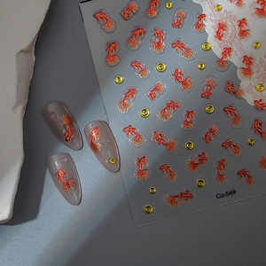Sparkling koi fish nail art stickers with gold glitter and red accents for DIY manicure