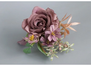 Macro detail of artificial dusty purple rose corsage with vintage style flower texture