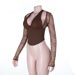 Macro detail of brown lace texture and stitching on sexy slim-fit corset top