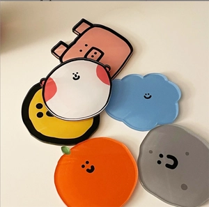 Flat lay of colorful cute cartoon acrylic coasters in pig and cloud shapes