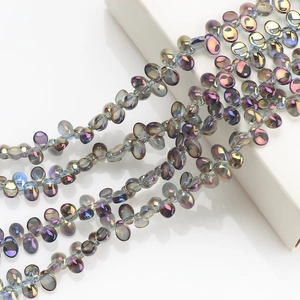 Macro detail of crescent crystal pendants with iridescent rainbow coating for DIY jewelry
