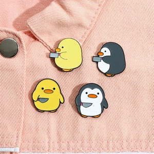 Cute penguin and duck enamel pins set for bags, featuring funny meme animals on denim