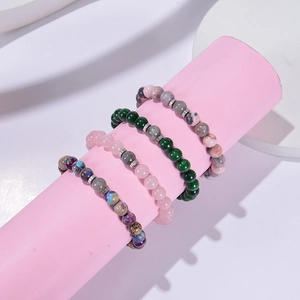 Bracelets en perles de jaspe zèbre rose et pierre de lune avec charms métal