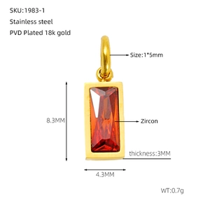 Macro view of 18K gold-plated stainless steel charm with red zircon and dimension details