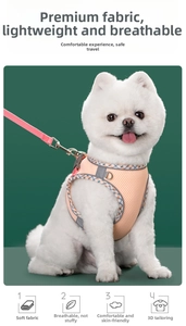 Detail view of breathable orange mesh dog harness with reflective trim and metal D-ring