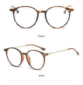 Detail view of round tortoiseshell glasses frame with slim gold metal temples and dual angles